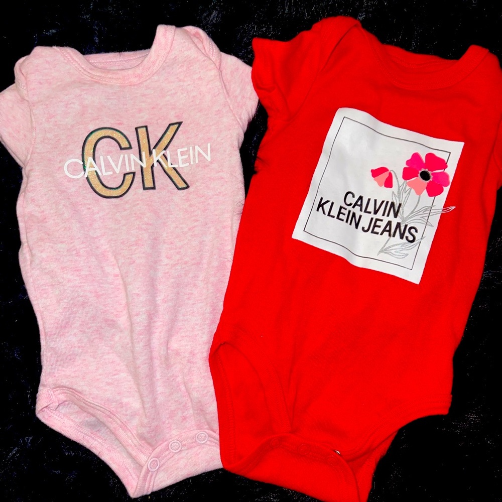 Two Calvin Klein onesies baby girl 0-3 months worn one time